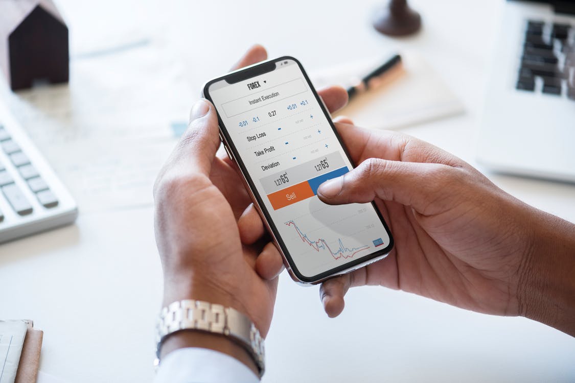 person using scheduling app on smartphone